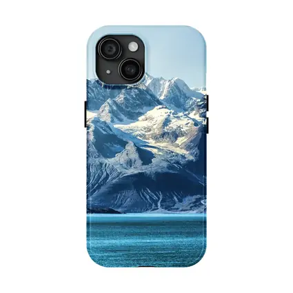 Snow Capped Mountains Over Turquoise Glacial Lake