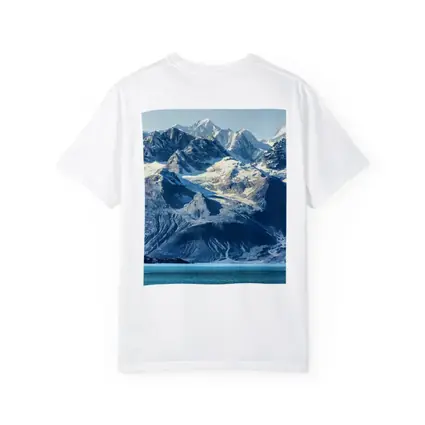 Snow Capped Mountains Over Turquoise Glacial Lake