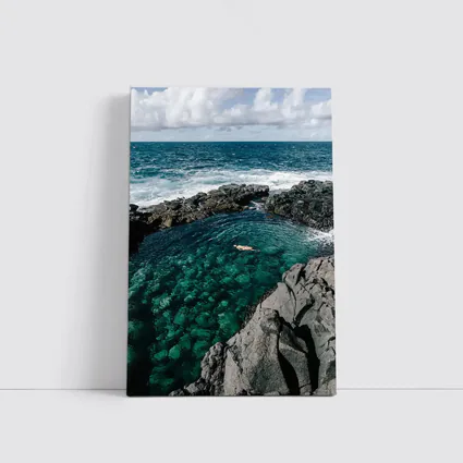 Swimmer In Clear Turquoise Volcanic Rock Pool