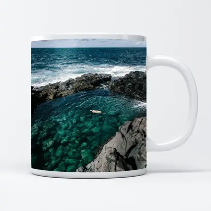 Swimmer In Clear Turquoise Volcanic Rock Pool
