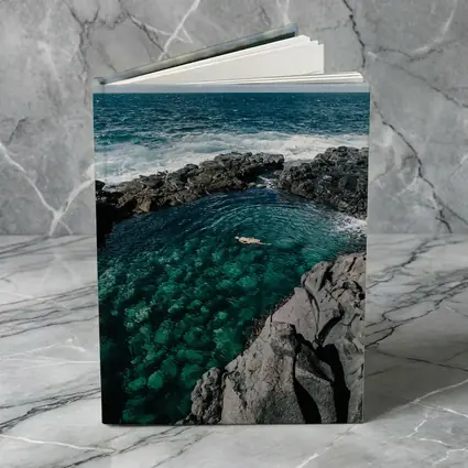 Swimmer In Clear Turquoise Volcanic Rock Pool