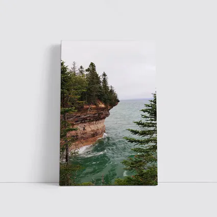 Red Sandstone Cliff Above Teal Lake