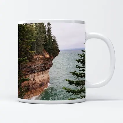 Red Sandstone Cliff Above Teal Lake