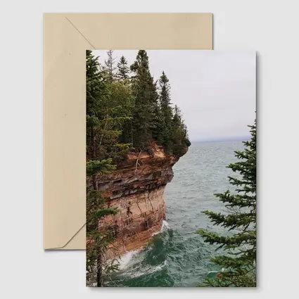 Red Sandstone Cliff Above Teal Lake