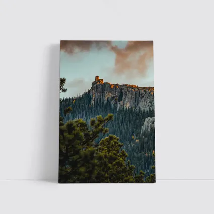Stone Watchtower Atop Rocky Mountain Cliff