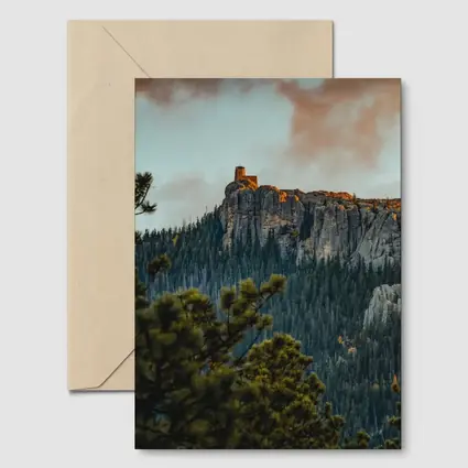 Stone Watchtower Atop Rocky Mountain Cliff