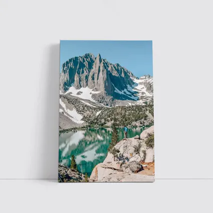 Hiker Standing by Alpine Lake Mountain
