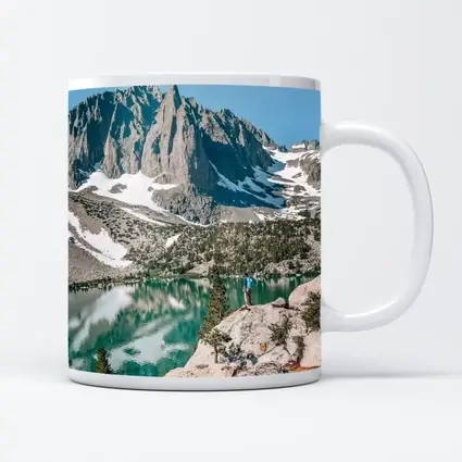 Hiker Standing by Alpine Lake Mountain