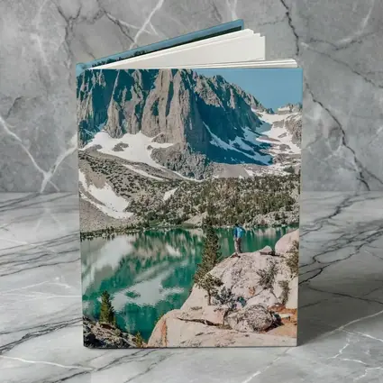 Hiker Standing by Alpine Lake Mountain