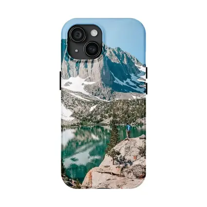 Hiker Standing by Alpine Lake Mountain