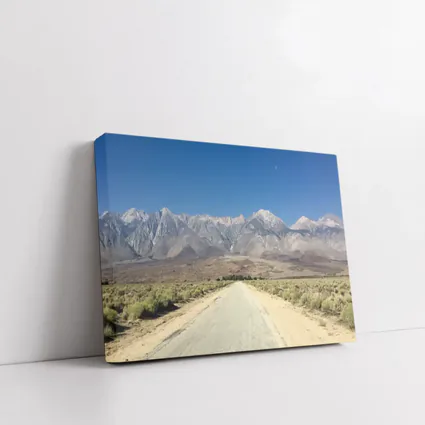 Desert Road Leading To Sierra Nevada Mountains