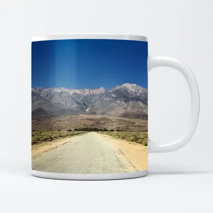 Desert Road Leading To Sierra Nevada Mountains