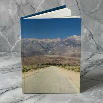 Desert Road Leading To Sierra Nevada Mountains