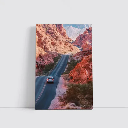SUV Driving Through Red Rock Canyon Road