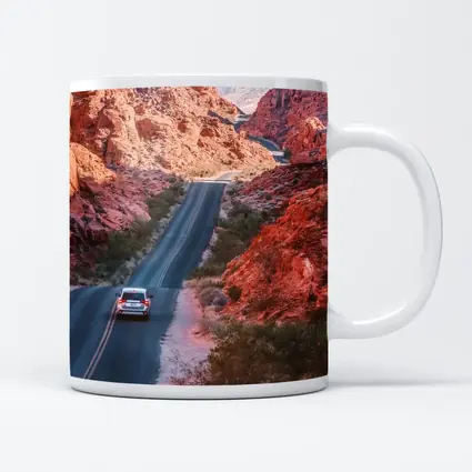 SUV Driving Through Red Rock Canyon Road