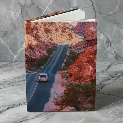 SUV Driving Through Red Rock Canyon Road