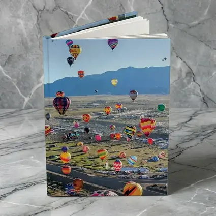Hot Air Balloons Over Desert Mountain Landscape