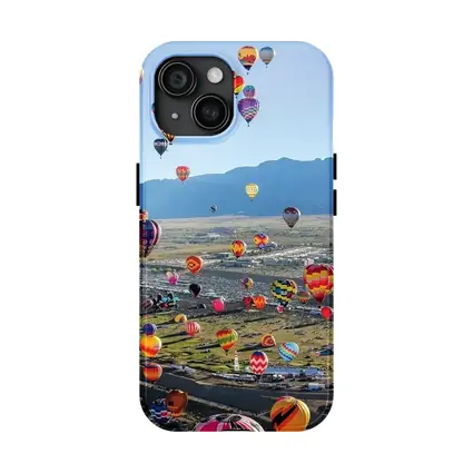 Hot Air Balloons Over Desert Mountain Landscape