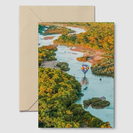 Hot Air Balloon Over Autumn River Landscape