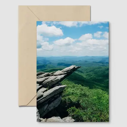 Rocky Cliff Overlooking Green Mountain Valleys