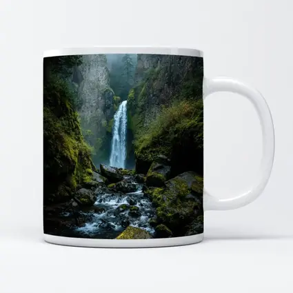 Misty Waterfall Cascading Over Mossy Rocks