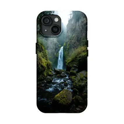 Misty Waterfall Cascading Over Mossy Rocks