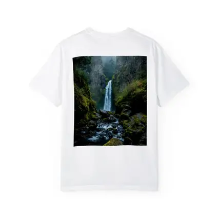 Misty Waterfall Cascading Over Mossy Rocks