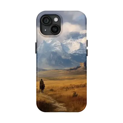 Lone Cowboy Riding Toward Snow Capped Mountains