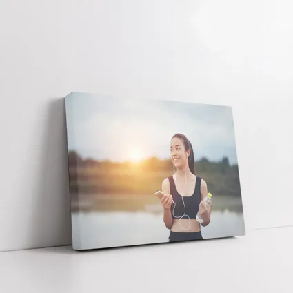Fit Woman Running Outdoors at Sunset