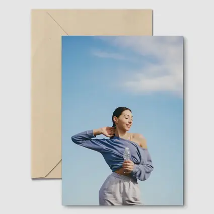 Woman Stretching Outdoors Under Blue Sky