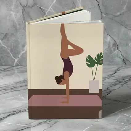 Woman Doing Handstand On Yoga Mat