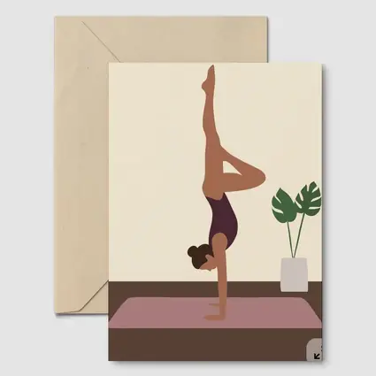Woman Doing Handstand On Yoga Mat