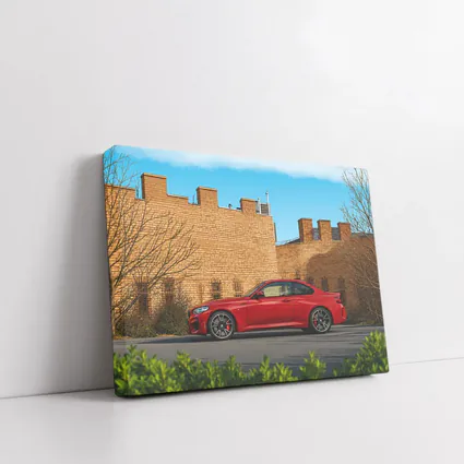 Red BMW M2 Parked Against Brick Wall