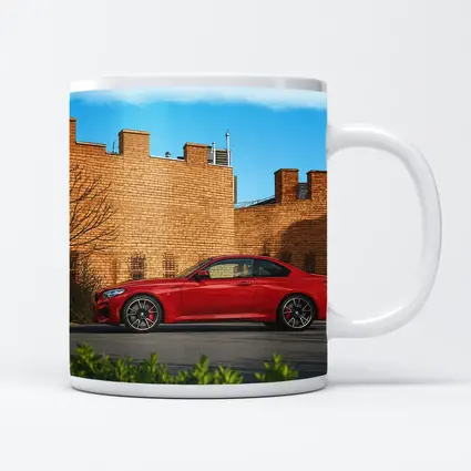 Red BMW M2 Parked Against Brick Wall