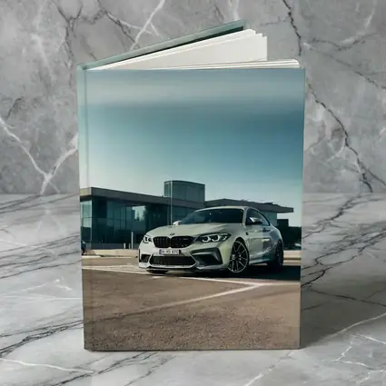 BMW M2 Competition Silver Parked Outside Building