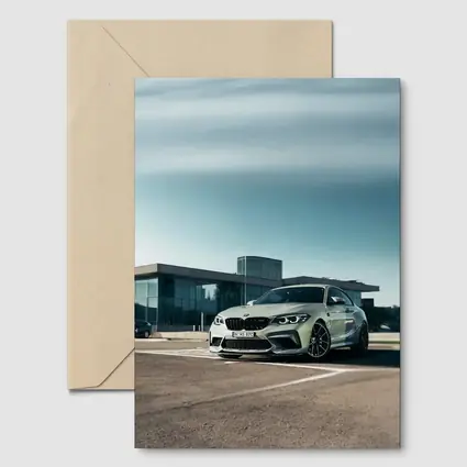 BMW M2 Competition Silver Parked Outside Building