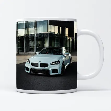 BMW M2 White Parked Outside Glass Building