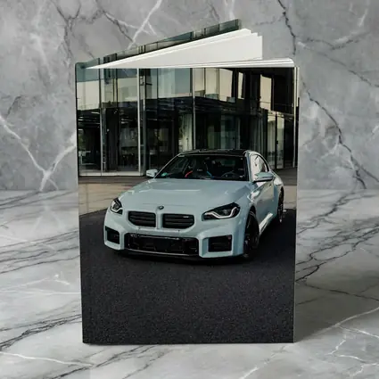 BMW M2 White Parked Outside Glass Building