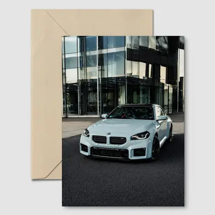 BMW M2 White Parked Outside Glass Building