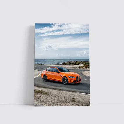 BMW M3 Orange Sedan Coastal Road Shot