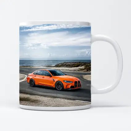 BMW M3 Orange Sedan Coastal Road Shot