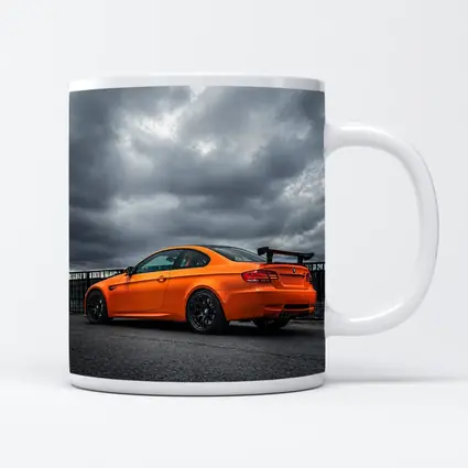 BMW M3 GTS Orange Under Stormy Sky