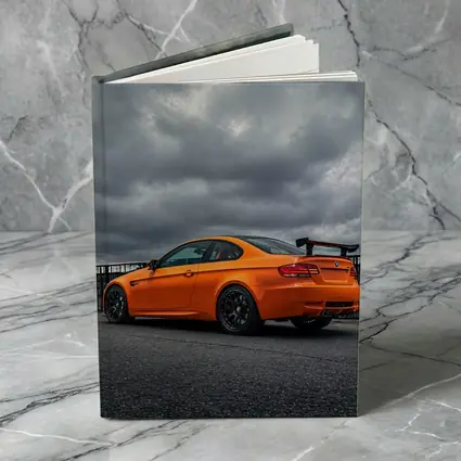 BMW M3 GTS Orange Under Stormy Sky