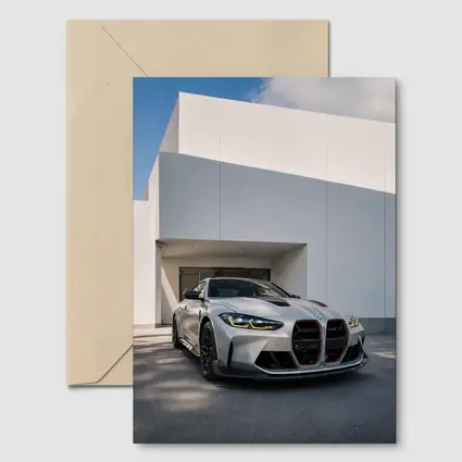 BMW M4 CSL Silver Against White Architecture