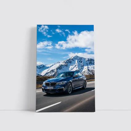 BMW M5 Sedan Speeding Through Alpine Mountains