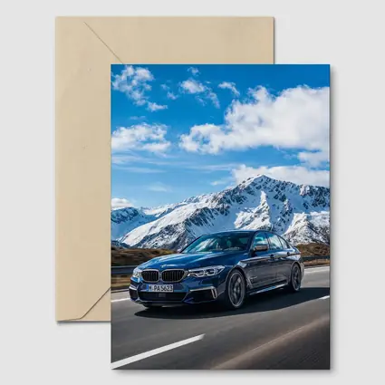 BMW M5 Sedan Speeding Through Alpine Mountains
