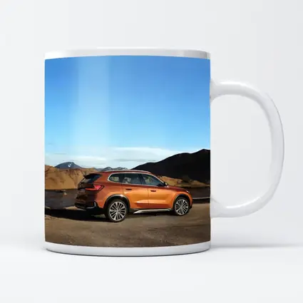 BMW X1 Orange SUV Desert Mountain Backdrop
