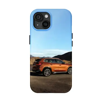 BMW X1 Orange SUV Desert Mountain Backdrop