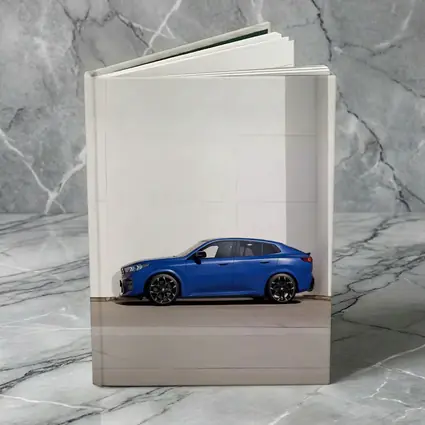 BMW X2 Blue Against White Wall