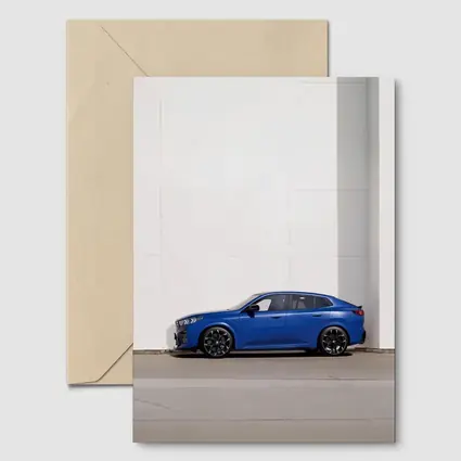 BMW X2 Blue Against White Wall